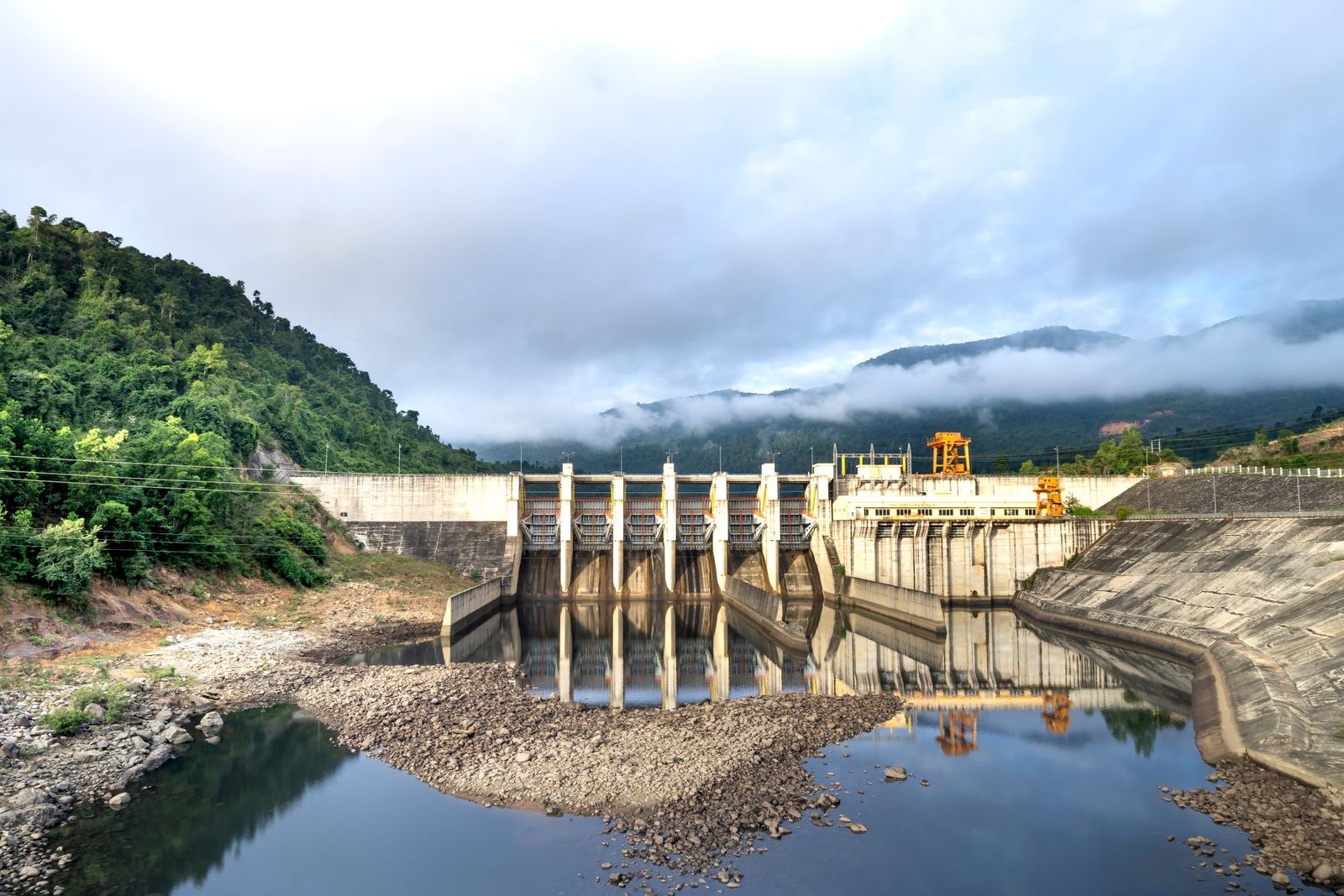 Industrial hydroelectric powerhouse beside a river